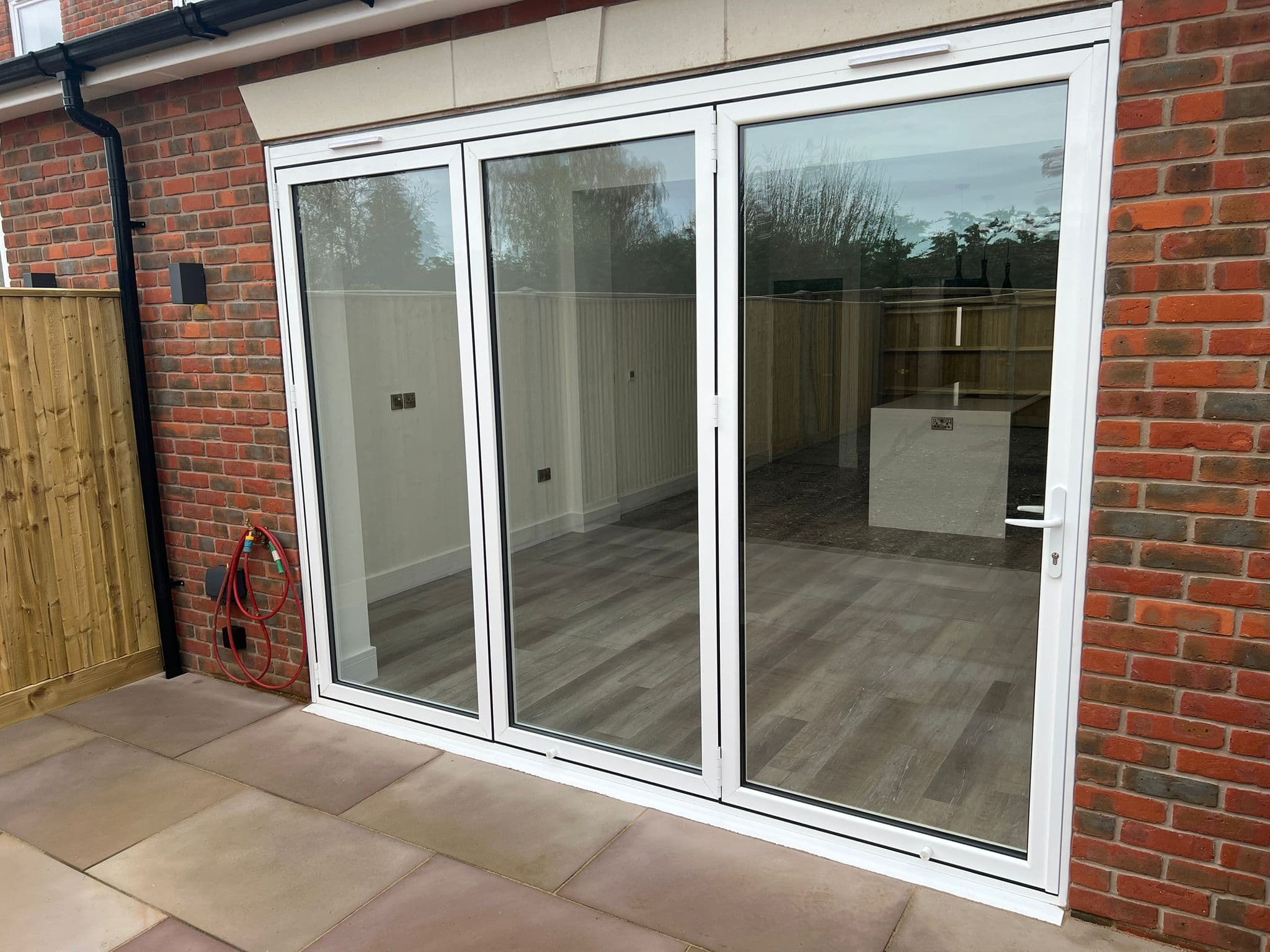 Smart “Visofold” bifold doors in white