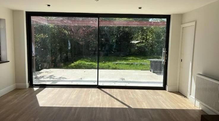 Origin Global “OS20” patio sliding doors in anthracite grey.