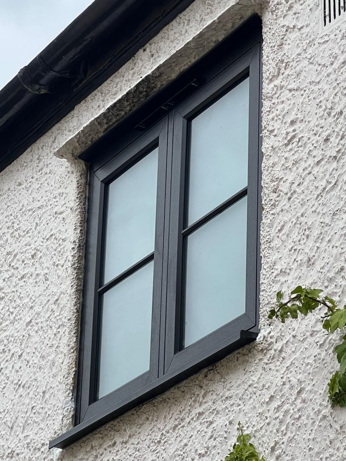 Rehau Rio flush casement window in anthracite grey, sash sitting level with the frame