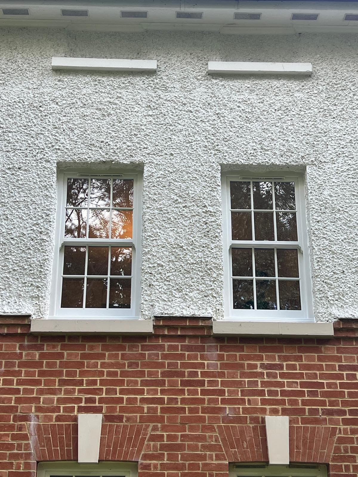 Quickslide uPVC sash windows in white, fitted by Skyway Windows in Surrey