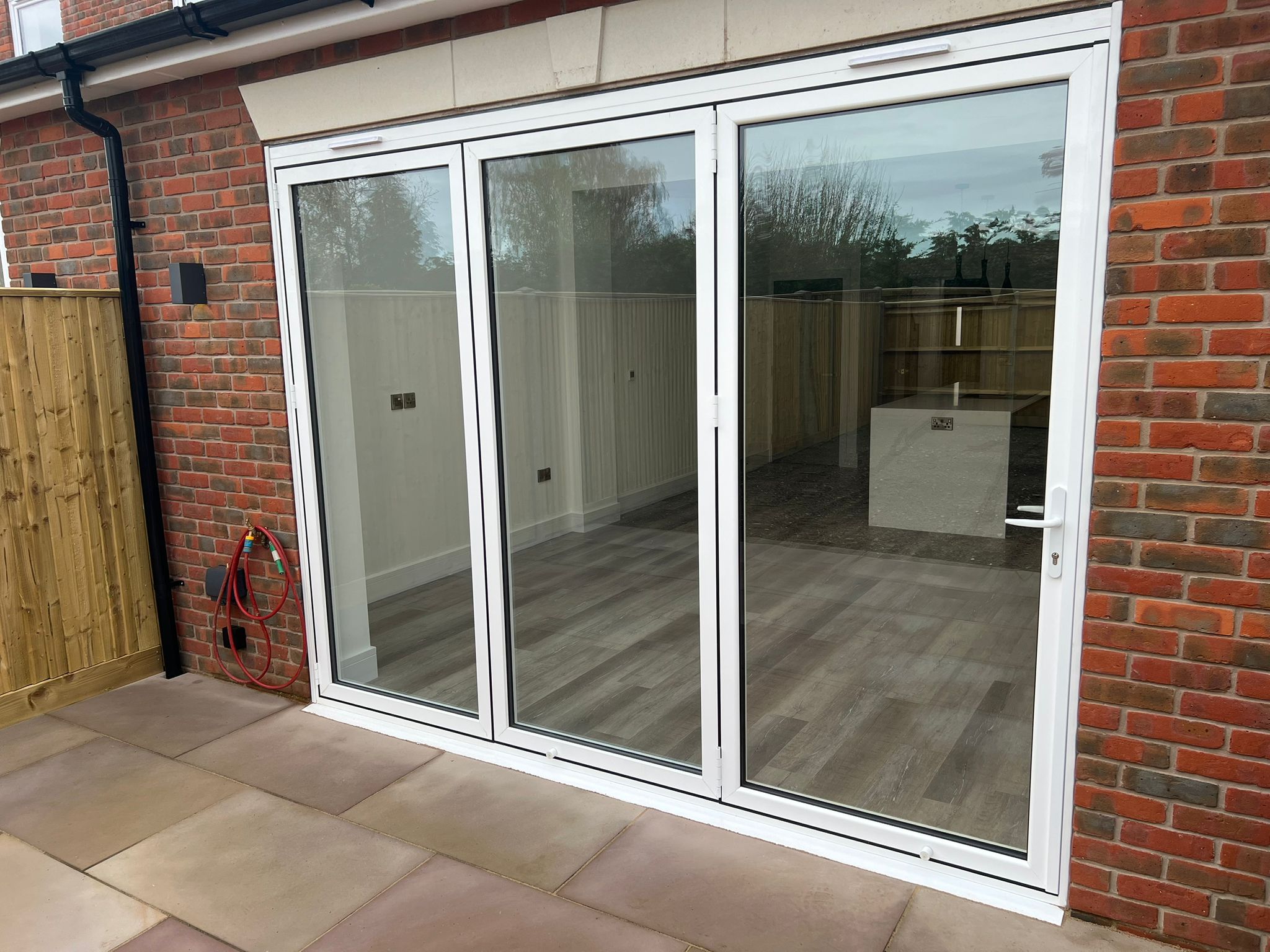 Smart “Visofold” bifold doors in white