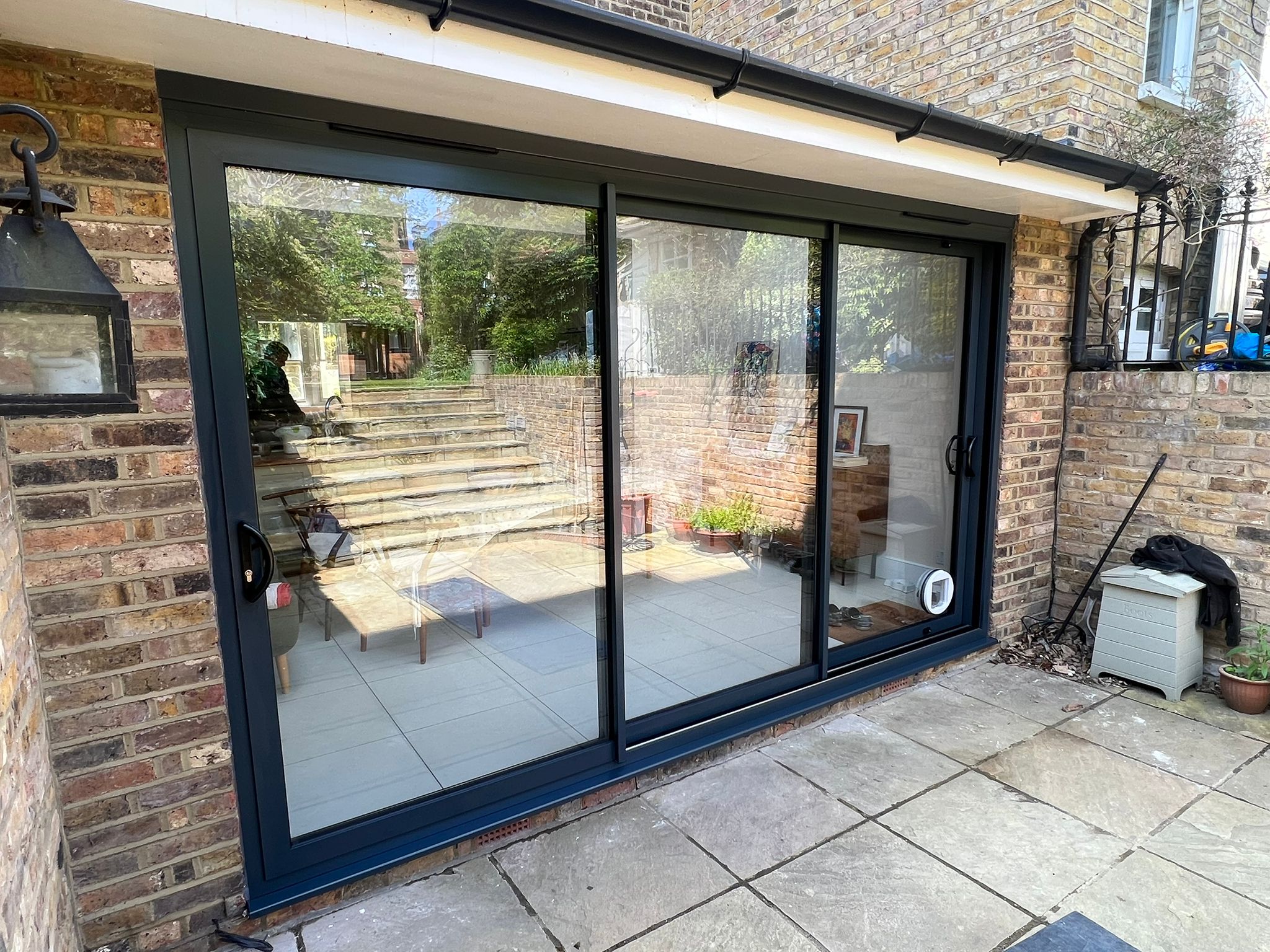Smart “Visoglide” patio sliding doors with slimline interlock in anthracite grey.