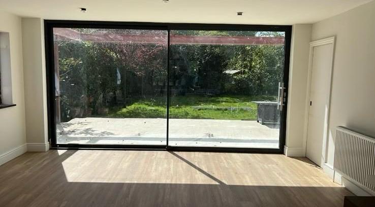 Origin Global “OS20” patio sliding doors in anthracite grey.