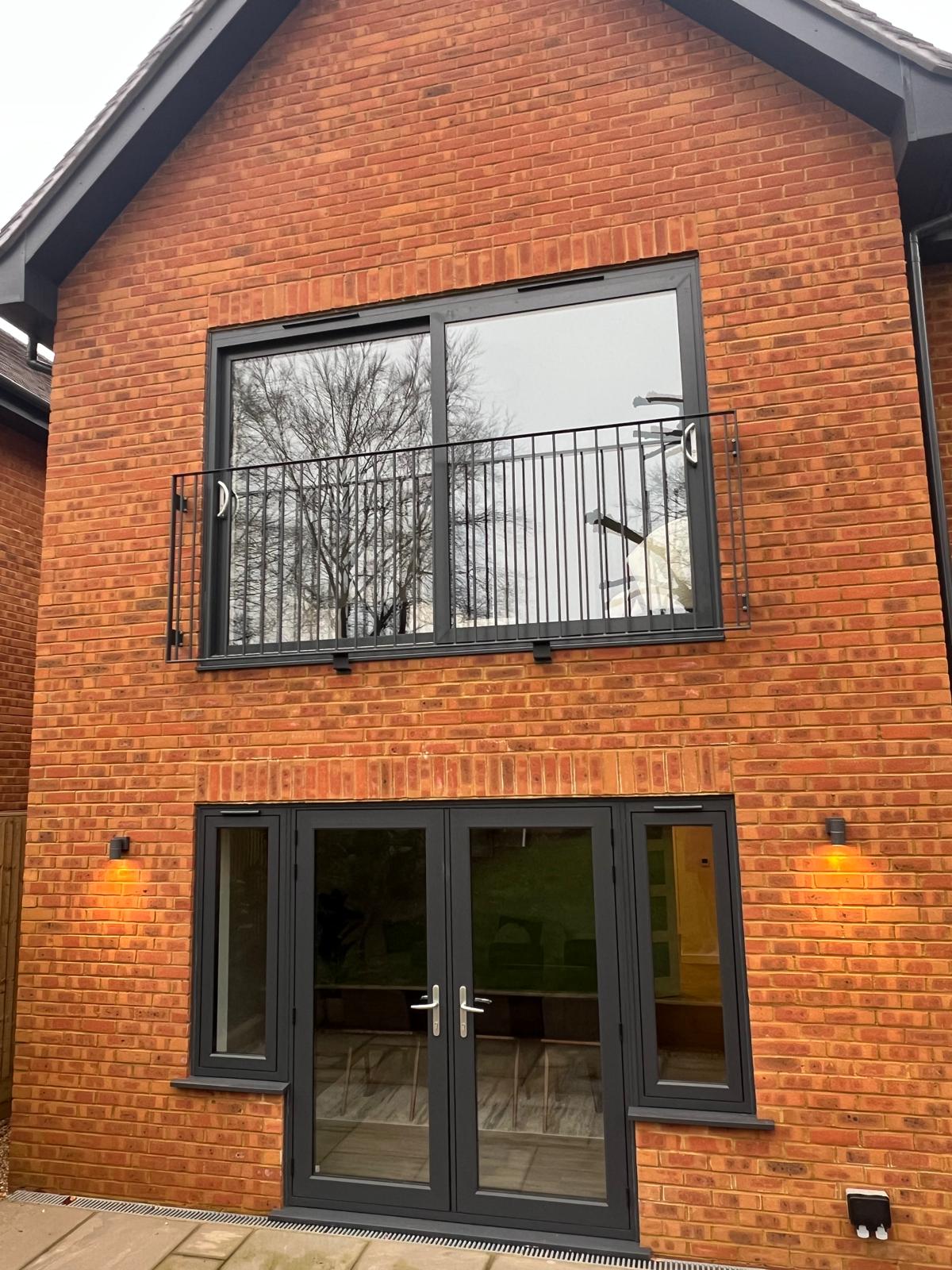 Smart “Visoglide” patio sliding door in anthracite grey. Renaissance 7 “French doors”.