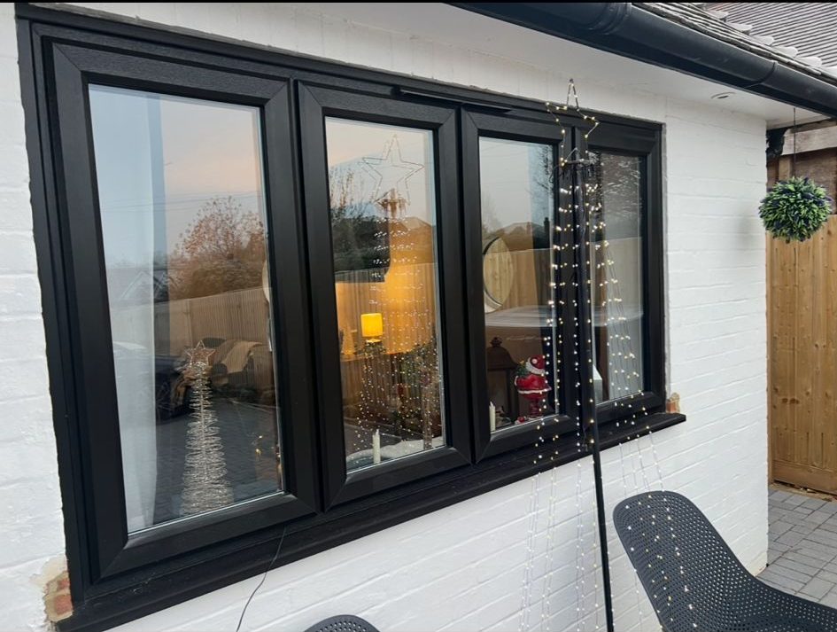 Kommerling casement windows in black woodgrain