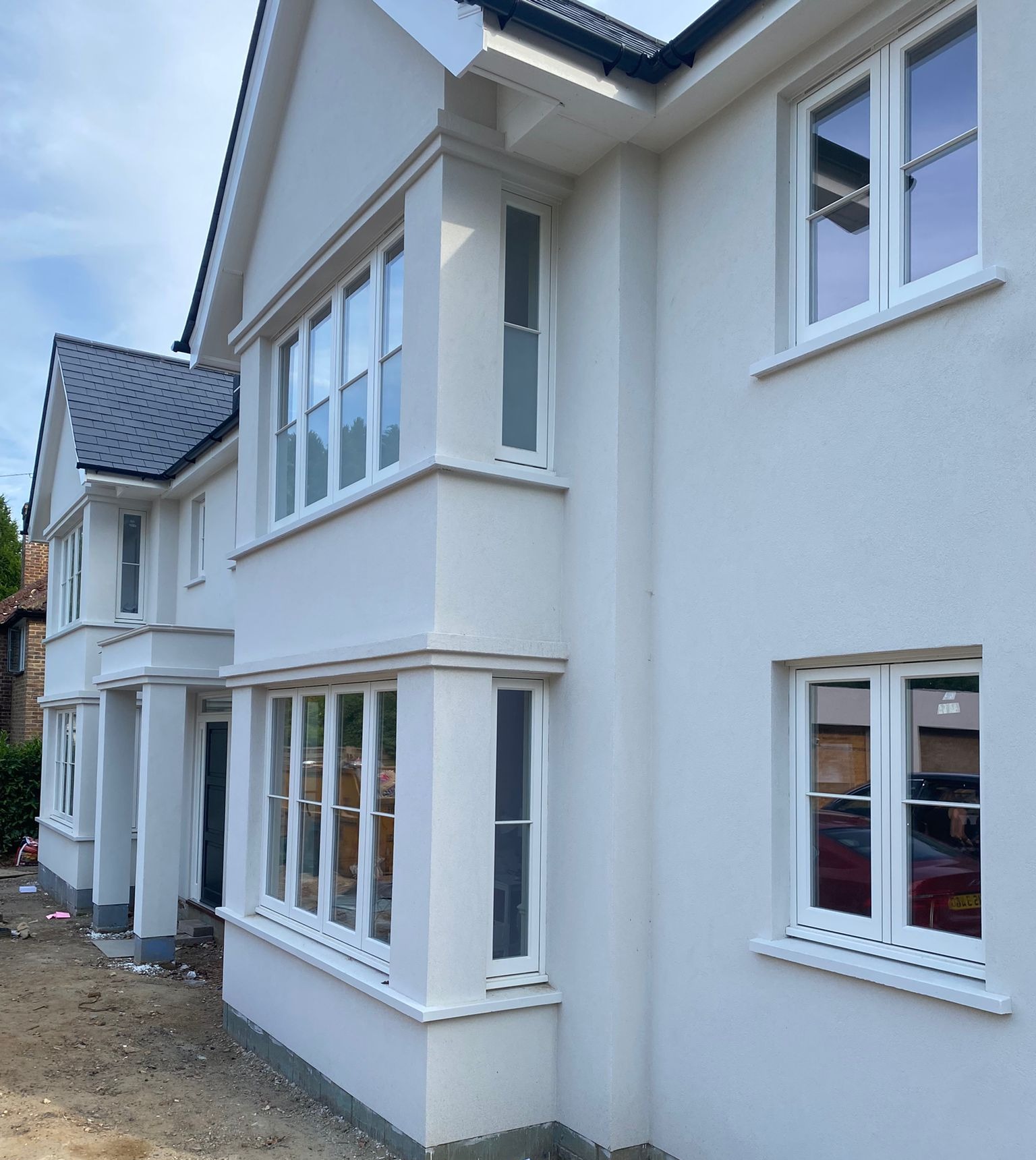 Bereco softwood flushfit casement windows with hardwood cills.
