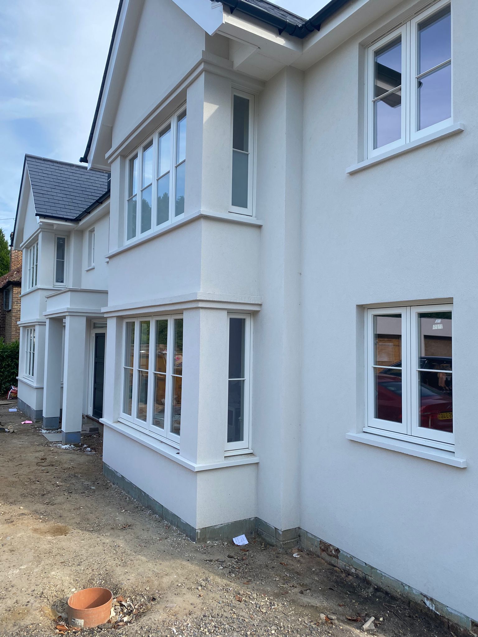 Bereco softwood flushfit casement windows with hardwood cills.